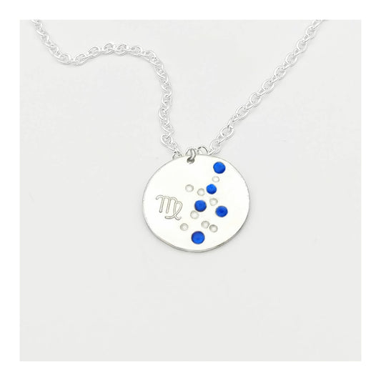 September Virgo necklace pendant with hand set sapphire colored glass rhinestones forming the constellation of Virgo. Hand stamped with the zodiac symbol for Virgo, on a 3/4th of an inch silver toned circle hanging from a silver toned chain.