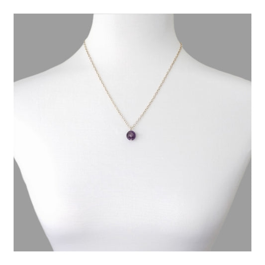 1 cm Amethyst bead on an adjustable gold toned chain with a maximum length of 24 inches. 