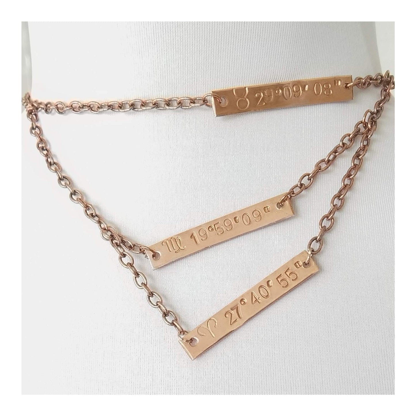 Personalized copper plaques 1 1/2 X 1/4th inch hand stamped zodiac sun sign and the degree of the sun at birth. With options of additional plaques for other family members or friends on a 16 inch, 18 inch and 20 inch (ect)  multi chained single necklace.    